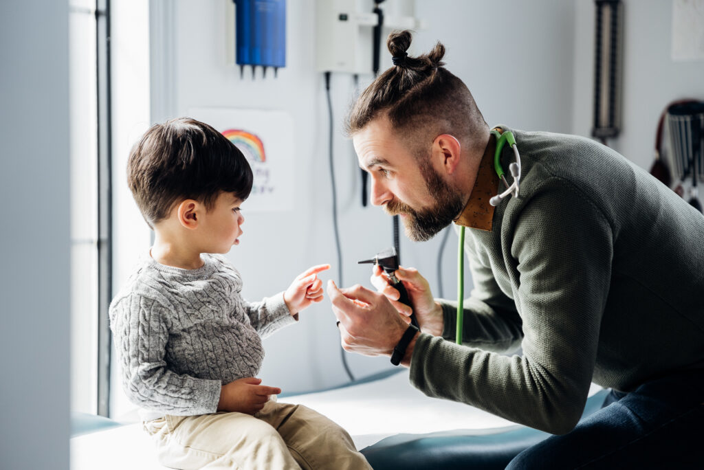 A family physician with a child patient