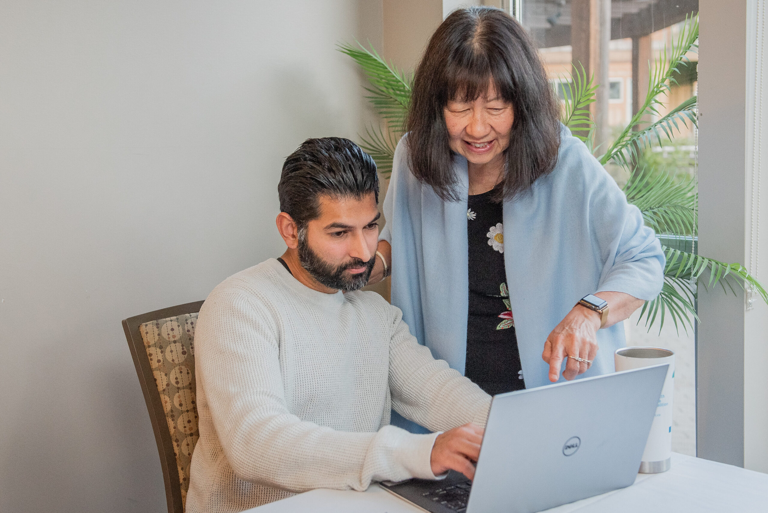 Two physicians discussing health data
